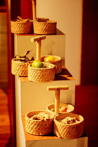 Fruits in basket on table at home