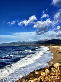 Scenic view of sea against cloudy sky