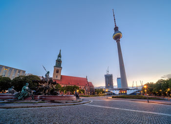 Low angle view of city street against clear sky