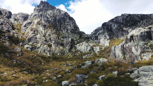 Scenic view of mountain rocks against sky