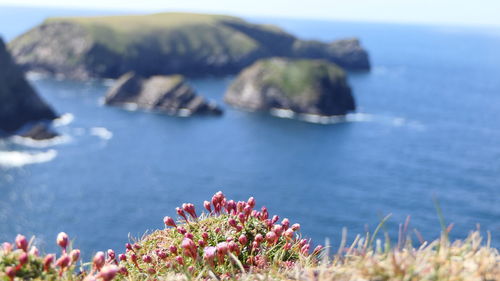 Scenic view of sea and rocks against sky