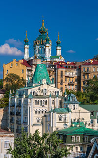 View of church in city against sky