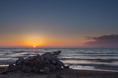 Scenic view of sea against clear sky during sunset