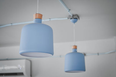 Low angle view of pendant light hanging on ceiling at home