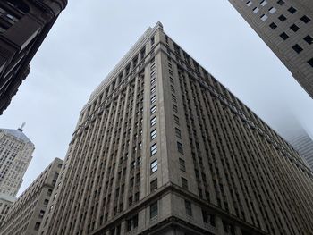 Low angle view of skyscrapers against sky