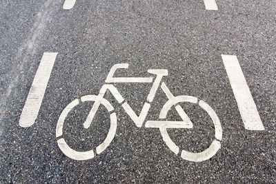 High angle view of bicycle sign on road