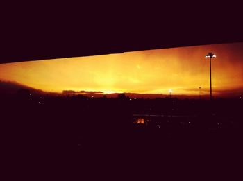 View of illuminated street light against sky at night