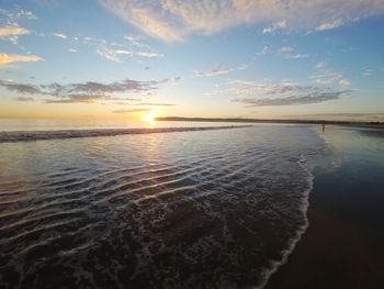 Scenic view of sea against sky at sunset