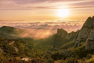 Scenic view of mountains against sky during sunset