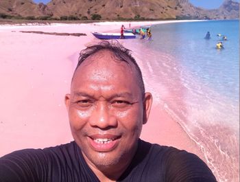 Portrait of smiling man on beach