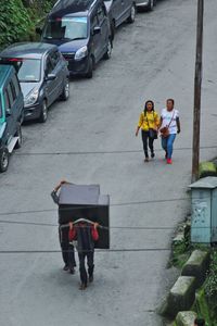 High angle view of people walking on street