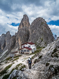 Rear view of man hiking on mountain