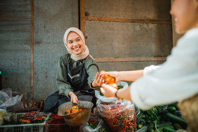 Portrait of young man holding food