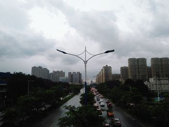 High angle view of traffic on city street against sky