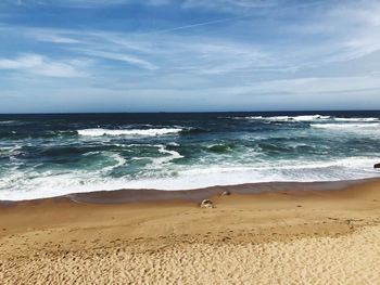Scenic view of beach against sky
