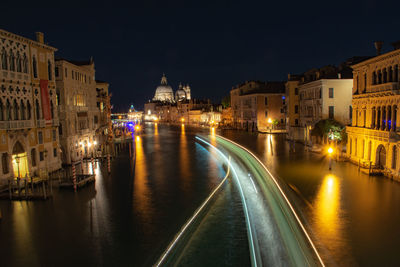 Illuminated buildings in city at night