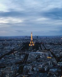 High angle view of cityscape and the eiffel tower against sky