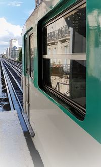 Train at railroad station against sky