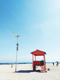 Lifeguard hut at beach against clear sky