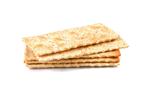 Close-up of bread against white background