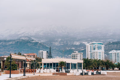 Buildings in city against sky