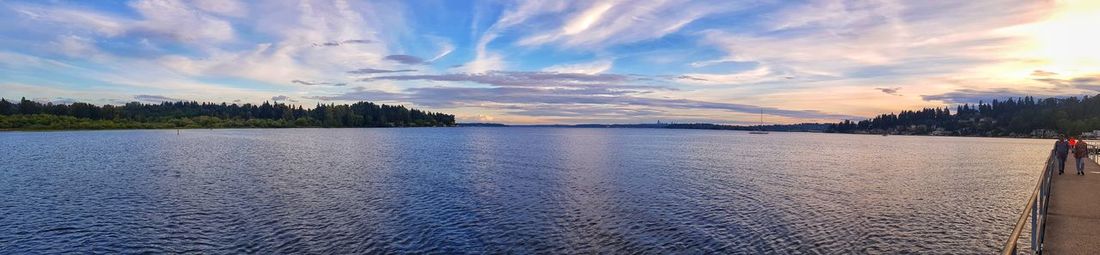 Scenic view of lake against sky at sunset