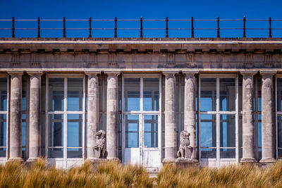 View of buildings against blue sky