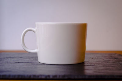 Close-up of coffee cup on table