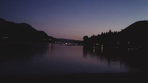 Scenic view of river against sky at sunset