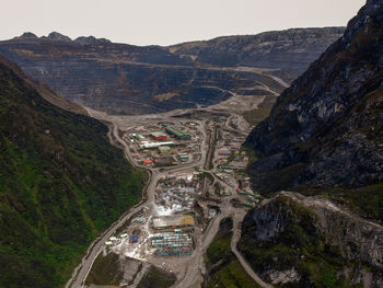 High angle view of road amidst mountains against sky