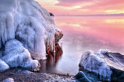 Frozen rocks on lakeshore during winter