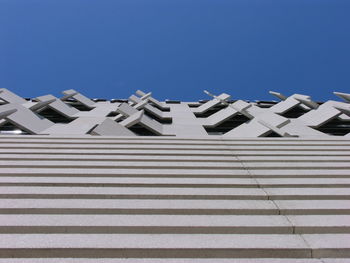 Low angle view of building against clear blue sky