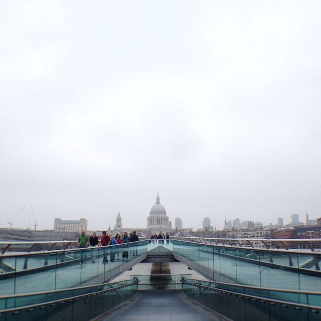 architecture, built structure, bridge - man made structure, water, building exterior, railing, connection, transportation, river, bridge, clear sky, city, copy space, travel destinations, sky, the way forward, travel, famous place, diminishing perspective, day