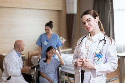 Portrait of doctor examining patient