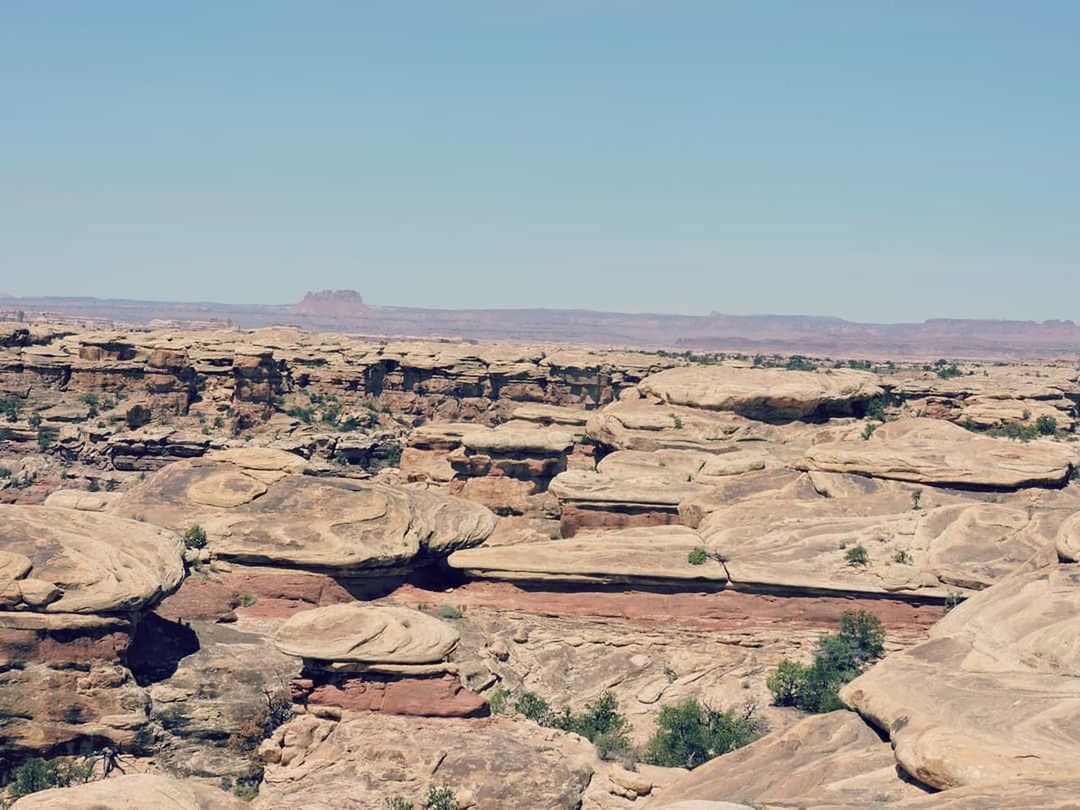 landscape, environment, scenics - nature, sky, rock, tranquil scene, non-urban scene, rock - object, rock formation, beauty in nature, clear sky, tranquility, nature, day, solid, no people, physical geography, travel destinations, geology, remote, arid climate, climate, outdoors, formation, eroded