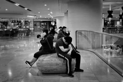 People sitting in shopping mall