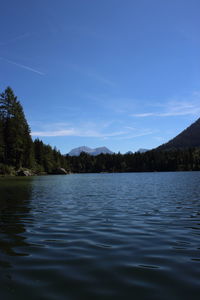 Scenic view of lake against blue sky