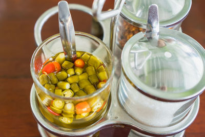 High angle view of vegetables in glass jar on table