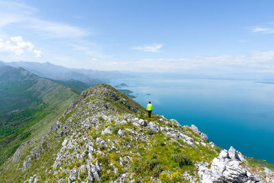 High angle view of townscape by sea against sky