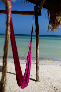 Hamac on beach against sky