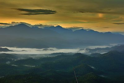 Scenic view of mountains against sky during sunset