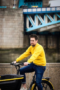 Side view of man riding bicycle