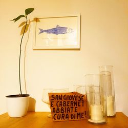 Information sign on table against wall at home