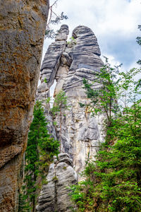 Low angle view of rocky mountain against sky