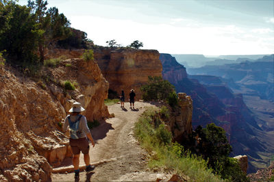 Rear view of people hiking on south kaibab trail at grand canyon