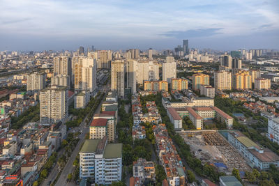 High angle view of buildings in city against sky