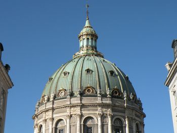 Low angle view of frederik church against clear blue sky