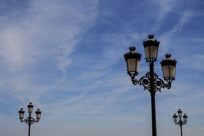 Low angle view of street light against sky