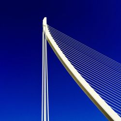 Low angle view of office building against blue sky