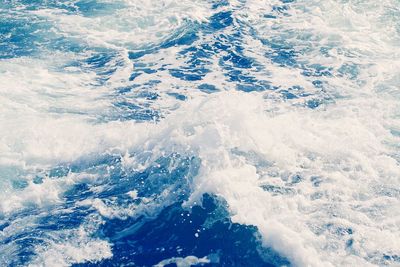 High angle view of waves splashing in sea